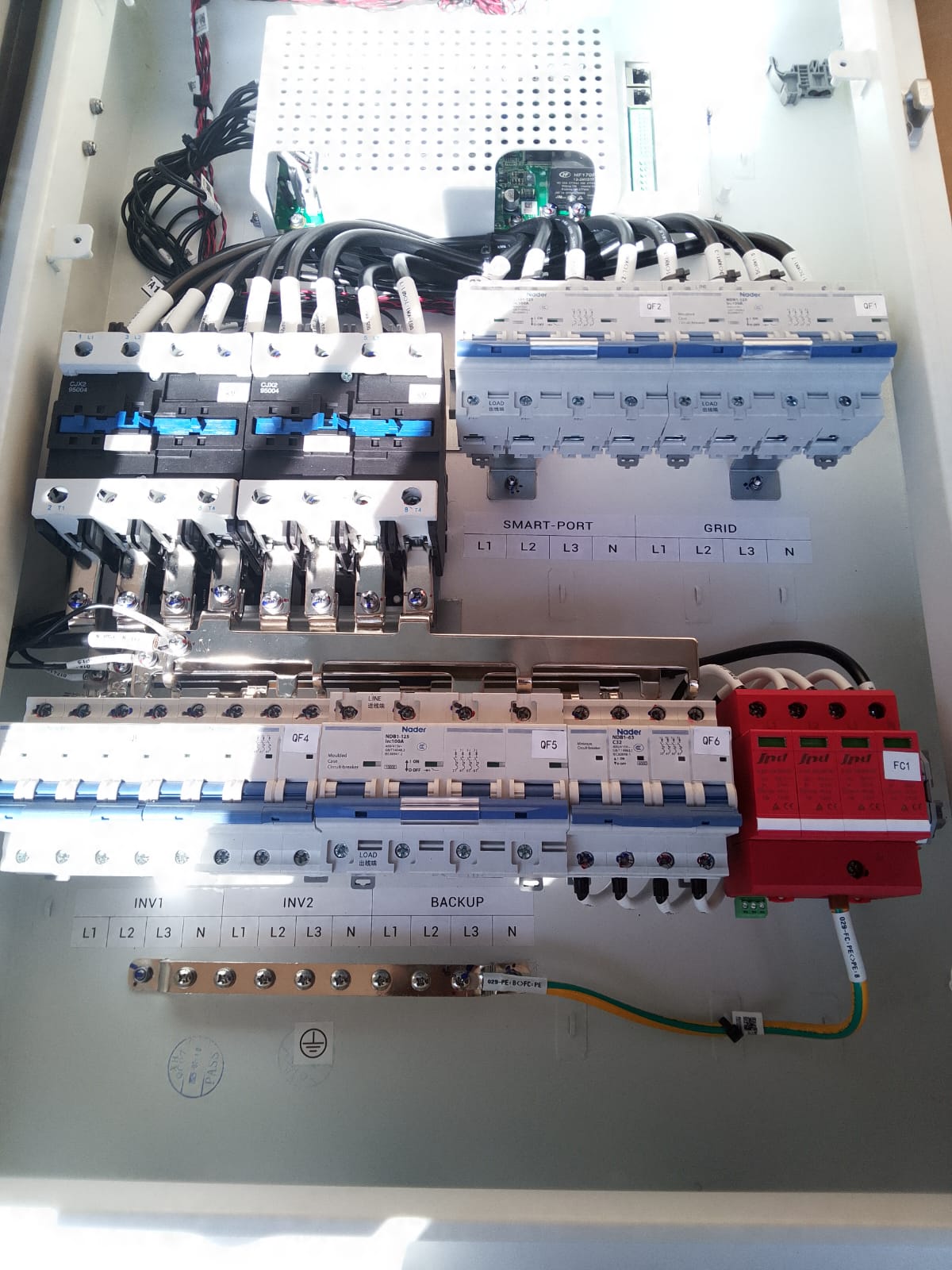 Electrician carrying out electrical maintenance and testing